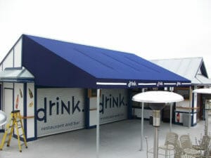 Canvas patio canopy with custom cut-outs and valance logos in Minneapolis