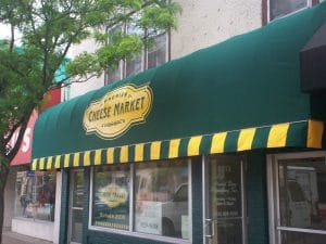 Classic cascade style awning with custom valance by Acme Awning