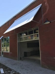Corrugated sheet metal awning by Acme Awning in Minneapolis