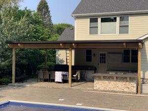 Residential customer with motorized louvered canopy to cover a patio.