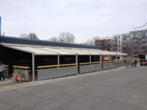 Commercial buildings make use of motorized retractable awnings from Acme Awning