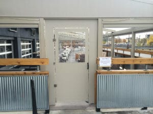 Acme Awning can keep the breeze out with a seasonal vestibule door
