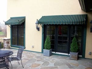 Custom spear Venetian awnings with a striped canvas in the Twin Cities