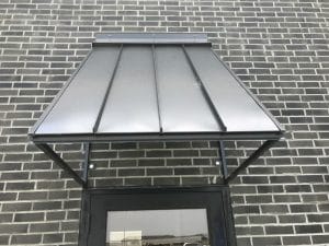 Close up of a standing seam sheet metal awning, custom ordered through Acme Awning in Minneapolis