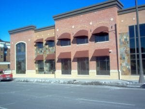 Traditional and rounded awnings on Twin Cities' commercial building