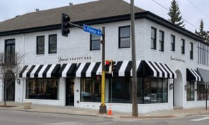 Minneapolis commercial awning with custom black and white stripes